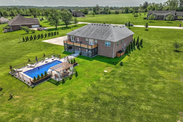 view of subject property with a pool