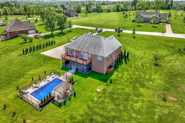 view from above of property featuring a pool area