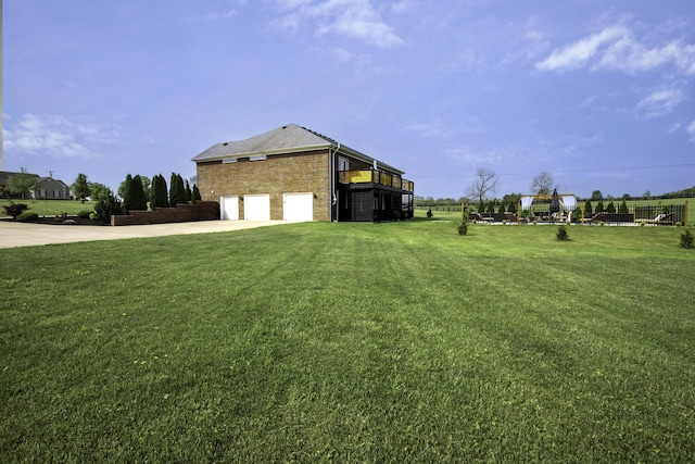 101 Creek Ridge Dr, Nicholasville, KY 40356 - view of side of home with a garage, driveway, a yard, and brick siding