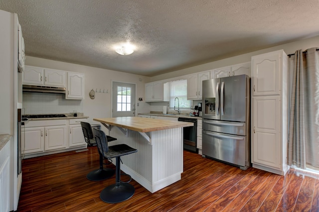 246 Pottersville Rd, Means, KY 40346 - kitchen featuring stainless steel fridge, wooden counters, dishwasher, under cabinet range hood, and white cabinetry