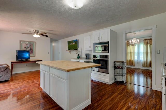 246 Pottersville Rd, Means, KY 40346 - kitchen with appliances with stainless steel finishes, butcher block counters, dark wood-style floors, white cabinets, and a textured ceiling