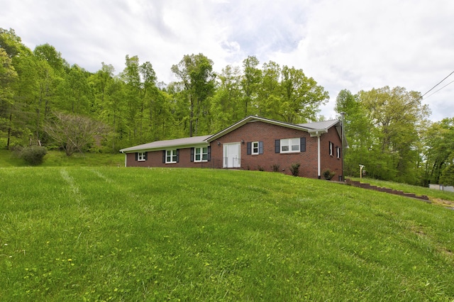 246 Pottersville Rd, Means, KY 40346 - view of front of home featuring brick siding and a front yard