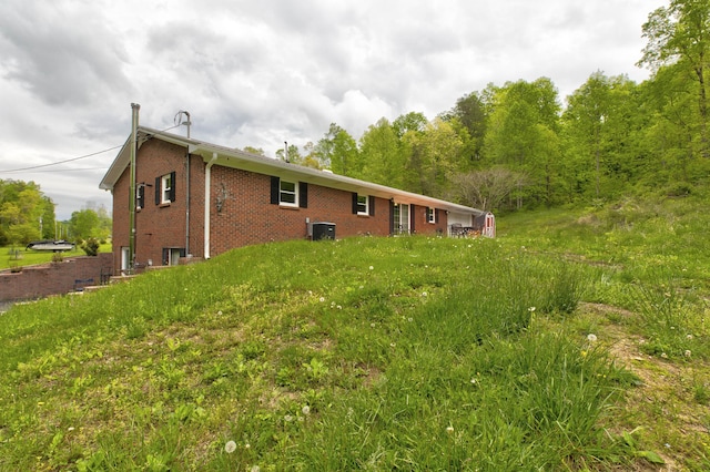 246 Pottersville Rd, Means, KY 40346 - back of property with brick siding and central AC