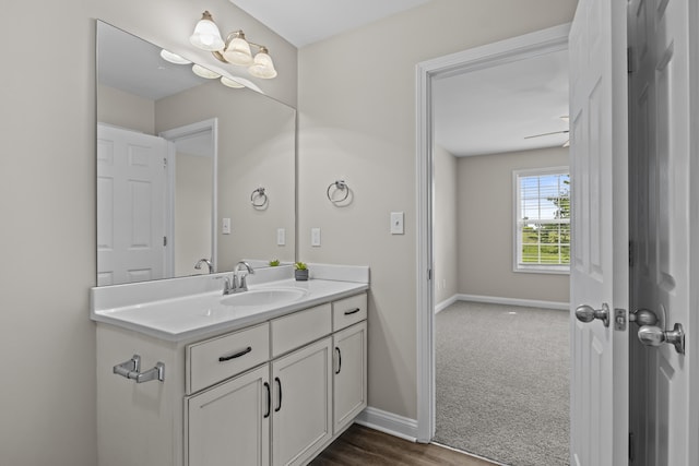 bathroom featuring vanity and baseboards