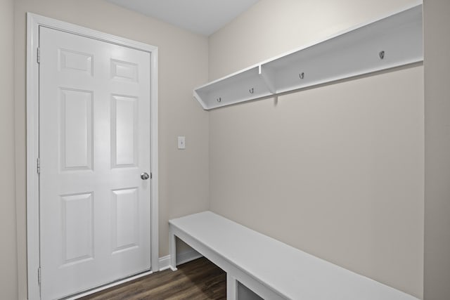 mudroom with dark wood-style floors and baseboards