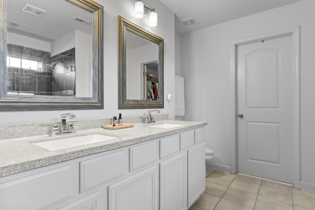 468 Lucille Dr, Lexington, KY 40511 - full bath featuring double vanity, toilet, tile patterned flooring, and tiled shower