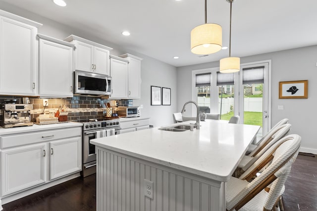 468 Lucille Dr, Lexington, KY 40511 - kitchen with stainless steel appliances, a sink, dark wood-style floors, tasteful backsplash, and recessed lighting