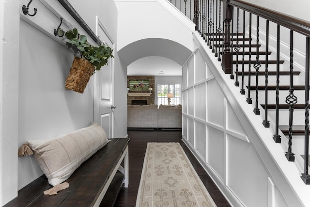 468 Lucille Dr, Lexington, KY 40511 - stairs with arched walkways, a fireplace, and wood finished floors
