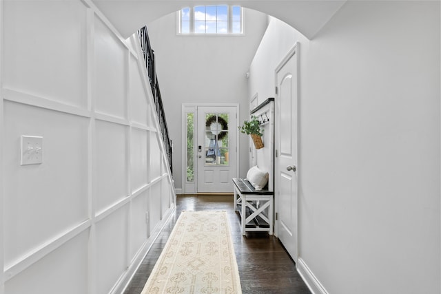 468 Lucille Dr, Lexington, KY 40511 - foyer with arched walkways, dark wood-type flooring, lofted ceiling, and baseboards