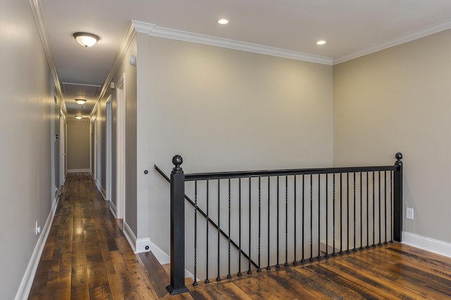corridor featuring an upstairs landing, wood-type flooring, recessed lighting, ornamental molding, and baseboards