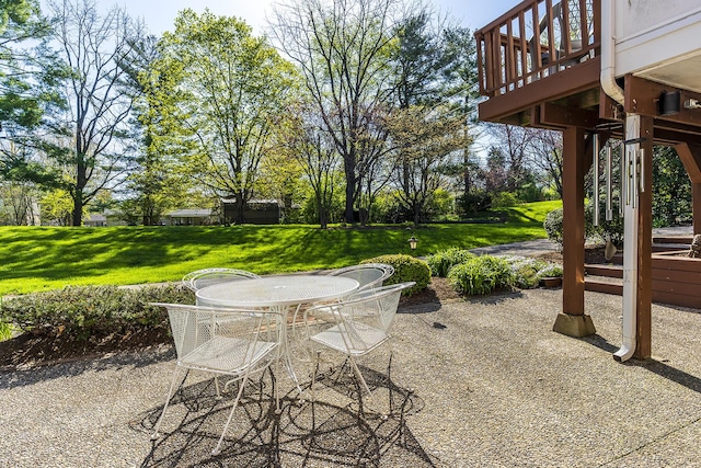 view of patio with a deck and outdoor dining space