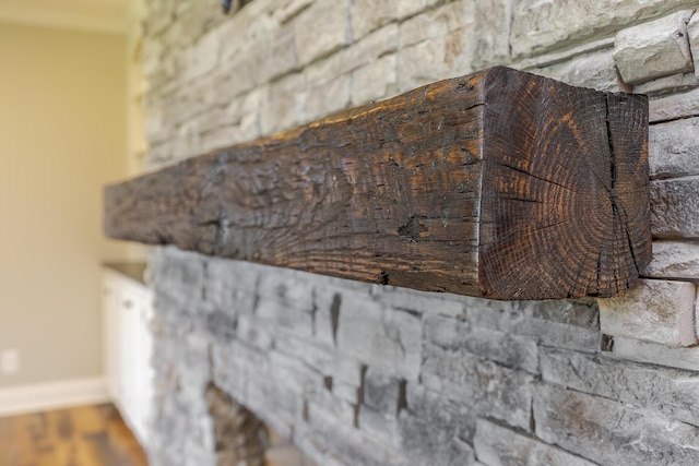 detailed view of baseboards and wood finished floors