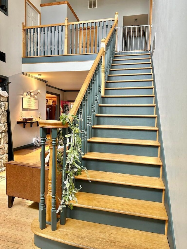80 Jackson Rd, Somerset, KY 42503 - staircase with visible vents, wood finished floors, and a towering ceiling