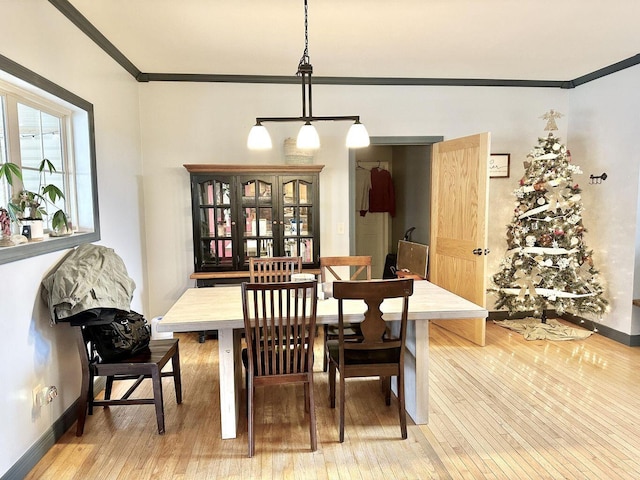 80 Jackson Rd, Somerset, KY 42503 - dining room with light wood finished floors, baseboards, and ornamental molding