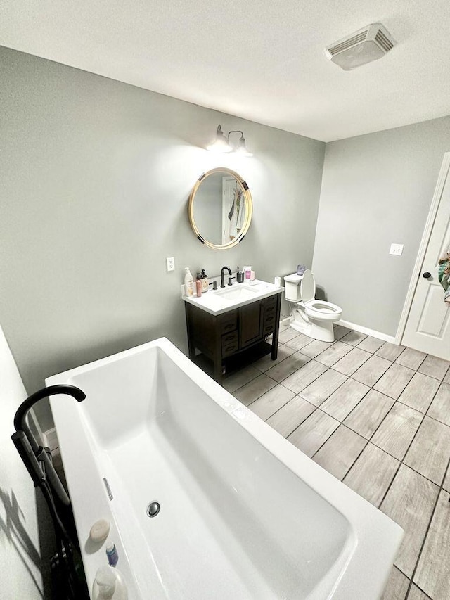 80 Jackson Rd, Somerset, KY 42503 - full bathroom featuring toilet, a soaking tub, visible vents, baseboards, and vanity
