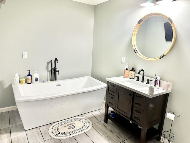 80 Jackson Rd, Somerset, KY 42503 - full bath with a freestanding bath, baseboards, wood finished floors, and vanity
