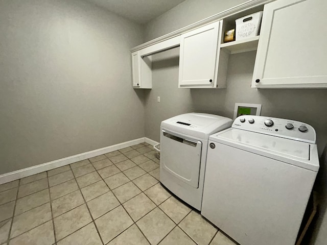 111 Fern Dr, Somerset, KY 42501 - clothes washing area featuring baseboards, washer and dryer, light tile patterned floors, and cabinet space