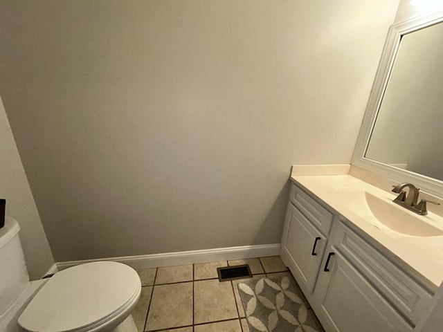 111 Fern Dr, Somerset, KY 42501 - half bathroom featuring toilet, vanity, visible vents, tile patterned floors, and baseboards