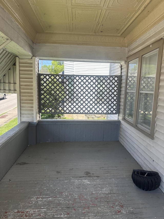 unfurnished sunroom with plenty of natural light