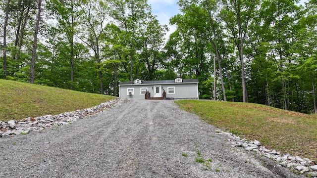 view of front of property with a front yard and driveway