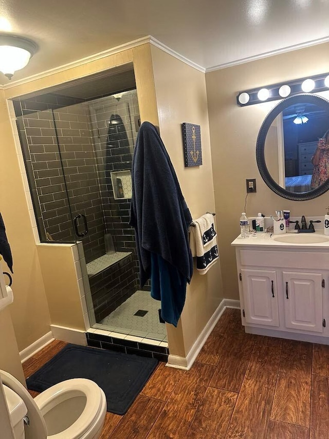 225 Mt Sterling Ave, Flemingsburg, KY 41041 - full bath featuring toilet, wood finished floors, a stall shower, crown molding, and baseboards