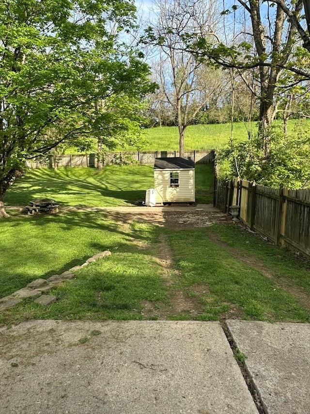 225 Mt Sterling Ave, Flemingsburg, KY 41041 - view of yard featuring a storage shed, an outdoor structure, and fence
