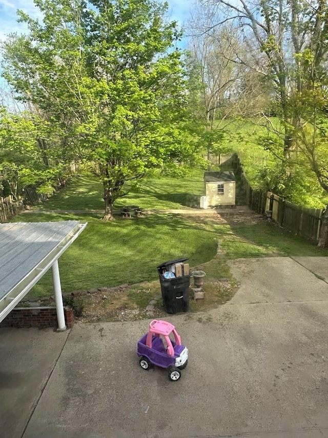 225 Mt Sterling Ave, Flemingsburg, KY 41041 - view of yard with a storage shed, an outdoor structure, fence, and a patio area