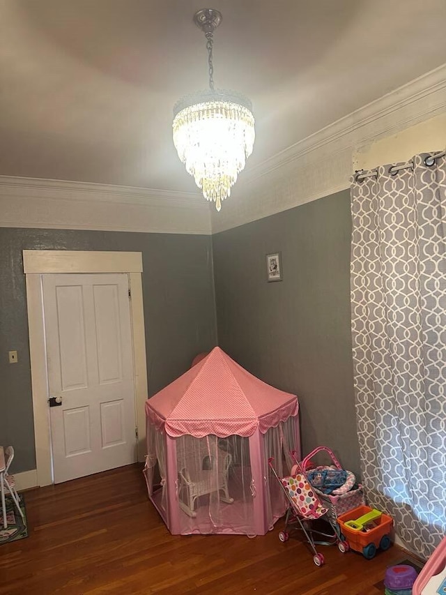 225 Mt Sterling Ave, Flemingsburg, KY 41041 - rec room featuring a chandelier, wood finished floors, and ornamental molding