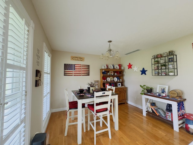 100 Dillon Ct, Berea, KY 40403 - dining space with baseboards, a notable chandelier, light wood finished floors, and visible vents