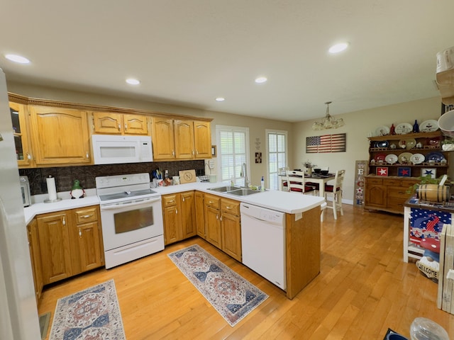 100 Dillon Ct, Berea, KY 40403 - kitchen featuring a sink, a peninsula, white appliances, and tasteful backsplash