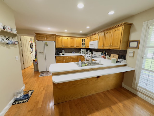 100 Dillon Ct, Berea, KY 40403 - kitchen with glass insert cabinets, white appliances, a sink, a peninsula, and tasteful backsplash