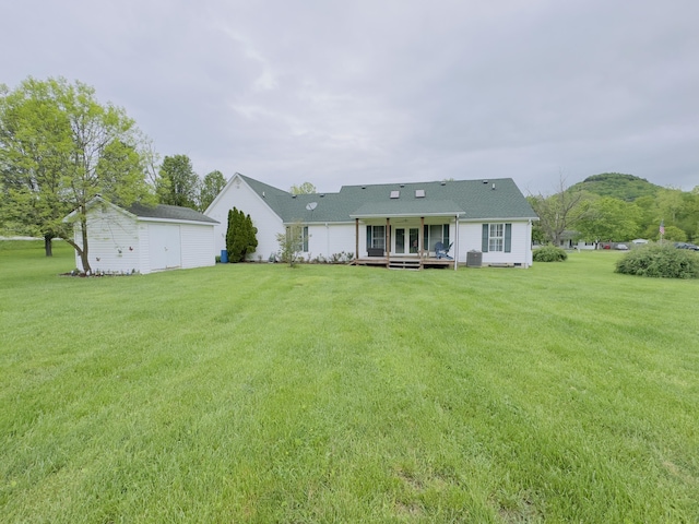 100 Dillon Ct, Berea, KY 40403 - rear view of house with an outdoor structure, a wooden deck, central AC unit, and a lawn