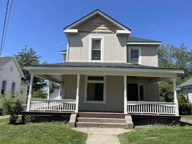 211 S Alta Ave, Danville, KY 40422 - farmhouse-style home with a porch, roof with shingles, and a front yard