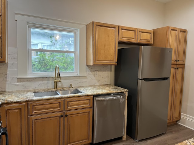 211 S Alta Ave, Danville, KY 40422 - kitchen featuring stainless steel appliances, brown cabinetry, and tasteful backsplash