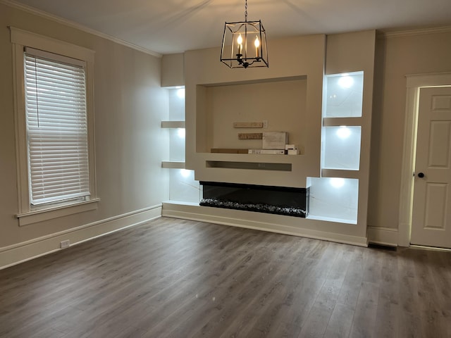 211 S Alta Ave, Danville, KY 40422 - unfurnished living room featuring ornamental molding, wood finished floors, and a chandelier