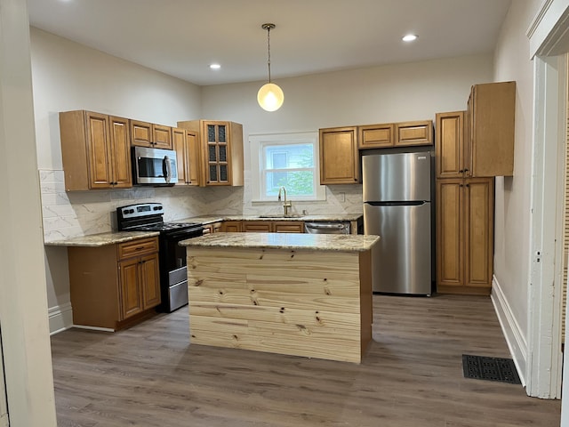 211 S Alta Ave, Danville, KY 40422 - kitchen with appliances with stainless steel finishes, brown cabinets, backsplash, and recessed lighting