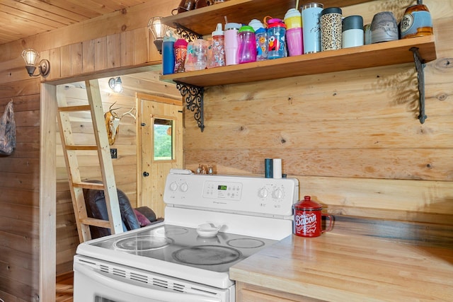 kitchen with open shelves, white electric range oven, wood ceiling, and wooden walls