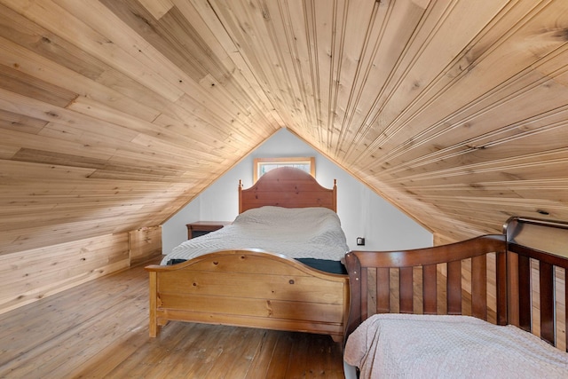 bedroom featuring wood ceiling, vaulted ceiling, and hardwood / wood-style floors