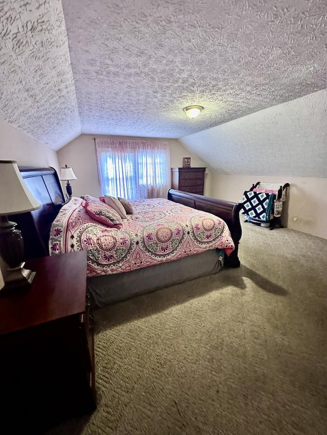 carpeted bedroom featuring a textured ceiling and lofted ceiling