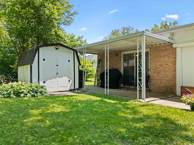 202 Leimaur Dr, Richmond, KY 40475 - rear view of property featuring a lawn, brick siding, and a patio area