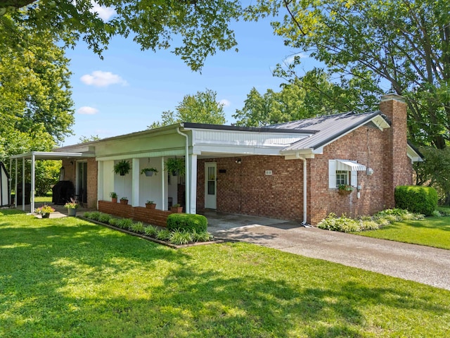 202 Leimaur Dr, Richmond, KY 40475 - ranch-style home with a front lawn, driveway, brick siding, and an attached carport