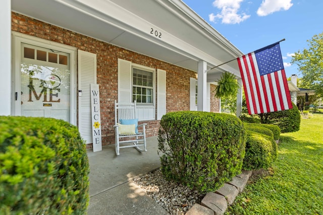 202 Leimaur Dr, Richmond, KY 40475 - view of exterior entry with brick siding and a porch