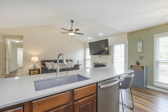 1208 Four Wynds Trl, Lexington, KY 40515 - kitchen with stainless steel dishwasher, a sink, open floor plan, ceiling fan, and light countertops