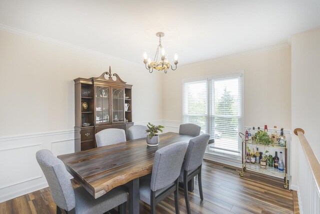 1208 Four Wynds Trl, Lexington, KY 40515 - dining room with a chandelier, a wainscoted wall, ornamental molding, dark wood-style floors, and a decorative wall