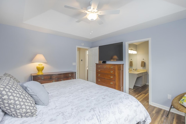 1208 Four Wynds Trl, Lexington, KY 40515 - bedroom with wood finished floors, baseboards, ceiling fan, and connected bathroom