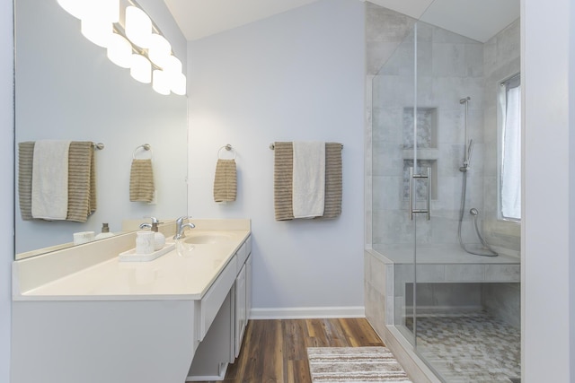 1208 Four Wynds Trl, Lexington, KY 40515 - full bathroom with vaulted ceiling, wood finished floors, baseboards, a stall shower, and vanity