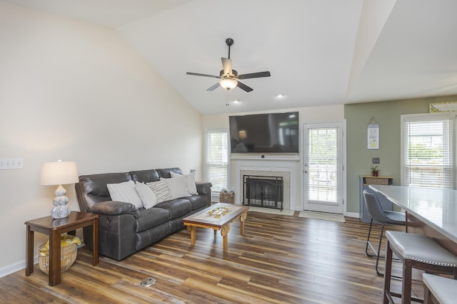 1208 Four Wynds Trl, Lexington, KY 40515 - living area featuring lofted ceiling, a ceiling fan, wood finished floors, a fireplace with flush hearth, and baseboards