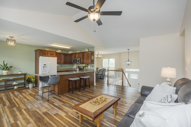1208 Four Wynds Trl, Lexington, KY 40515 - living room with dark wood-style floors, ceiling fan, a chandelier, and high vaulted ceiling