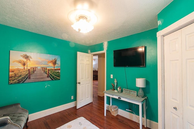 121 Meredith Ave, Frankfort, KY 40601 - bedroom with wood finished floors, a textured ceiling, and baseboards