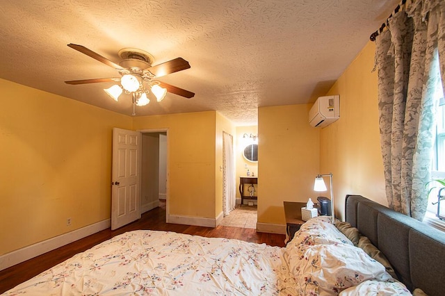 121 Meredith Ave, Frankfort, KY 40601 - bedroom featuring an AC wall unit, wood finished floors, a textured ceiling, and baseboards